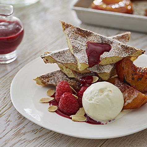 Sweet Waffles with Honey Roast Peaches, Vanilla Ice Cream, Toasted Almonds and Fresh Raspberries